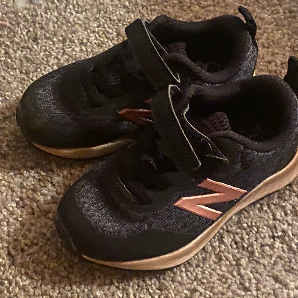 Rose gold and black New balance shoes